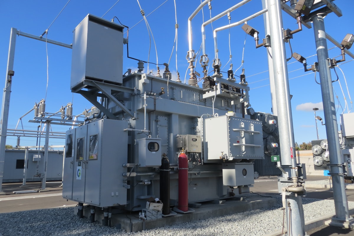 A substation power transformer with bushings and instrument transformers on top - the measurement CTs whose 0.2S or 0.5S accuracy class under IEC 61869-2 decides whether revenue metering reads true