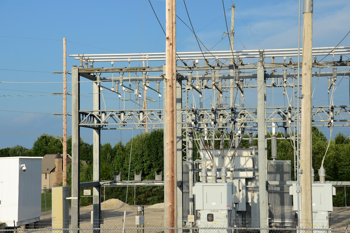 Electrical substation with power lines and instrument transformers — the kind of installation where SEG MRI3 and WIC1 g2 relays provide the 50/51/50N/51N protection coverage on each distribution transformer feeder