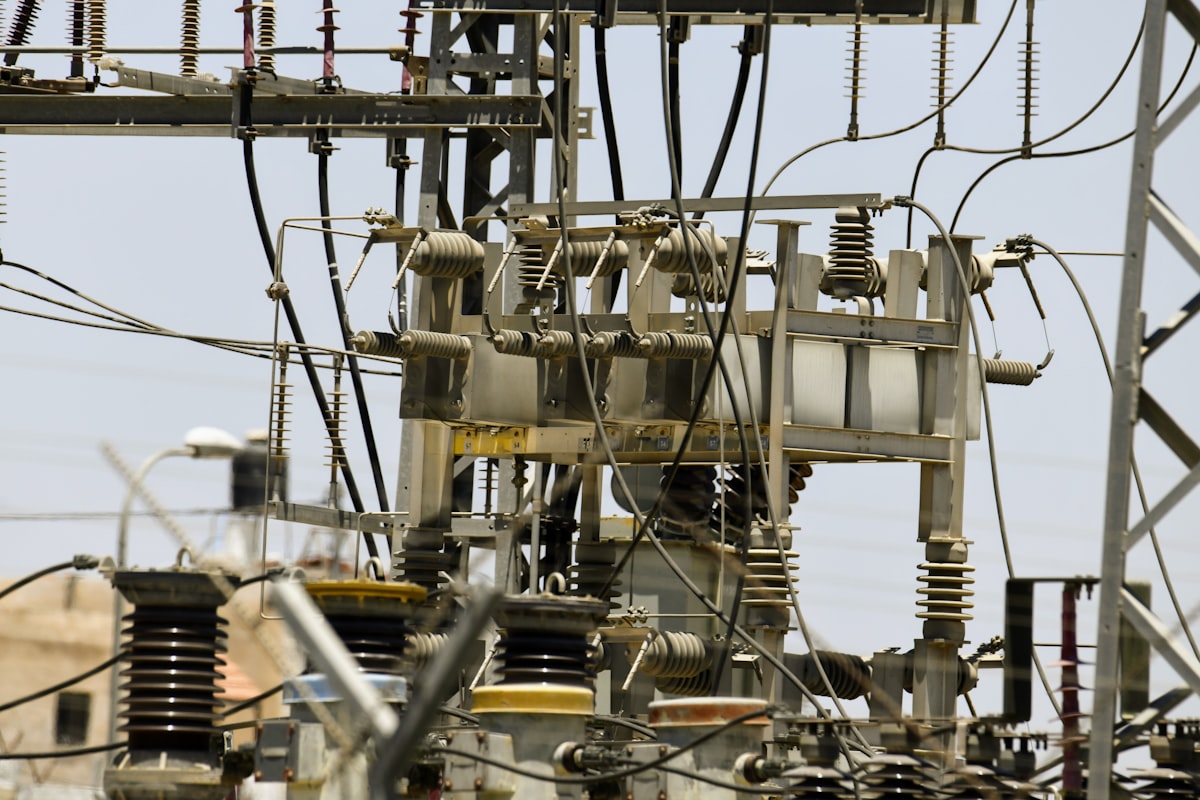 Substation bushings, insulators, and connection hardware in close-up - the oil-filled equipment whose dissolved gases IEC 60599 interpretation turns into a transformer health verdict